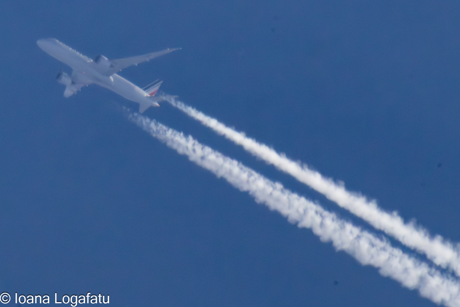 Majestic airplane soaring across clear blue skies
